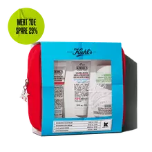 Kiehl's travel-sized skincare gift set in a red pouch, featuring multiple products visible through a blue-themed window.