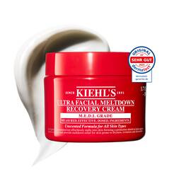 Roter Tiegel der Kiehl’s Ultra Facial Meltdown Recovery Cream Whip mit einer aufgeschlagenen Cremetextur.