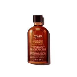 A graphic featuring a dark amber bottle of Kiehl's Ferulic Brew Facial Essence with a black cap. The label has white and yellow text that reads “100 ml".