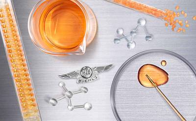 Bild einer Petrischale mit einer orangenen Flussigkeit