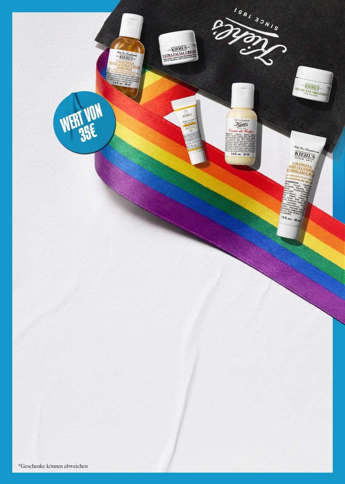 Kiehl's Pride-Set mit Miniaturprodukten im Wert von 35€, darunter Ultra Facial Cream, Calendula Herbal-Extract Toner, Creme de Corps und Calendula Deep Cleansing Face Wash, dekoriert mit einem Regenbogenband auf einer Kiehl's Tasche