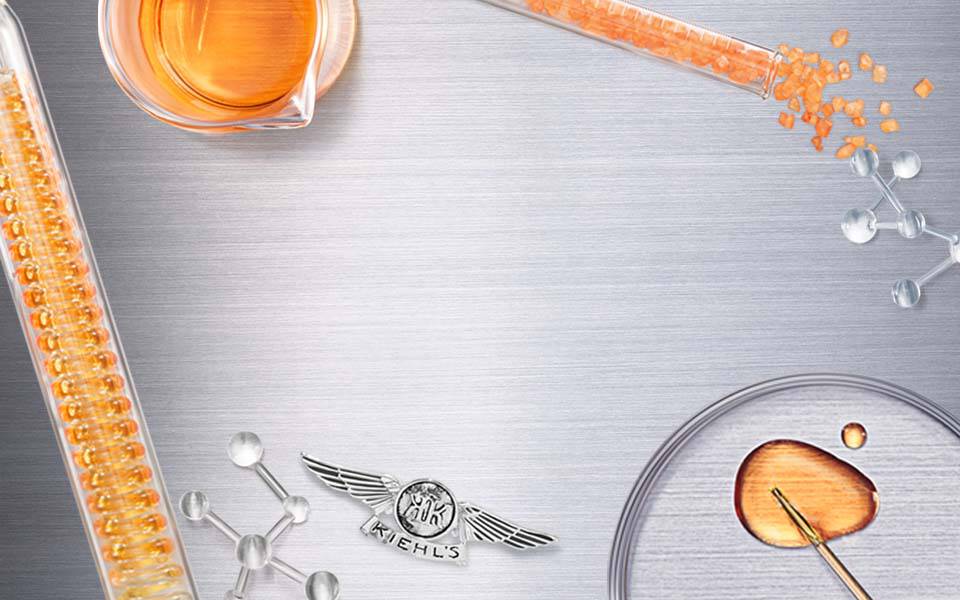 Kurze Beschreibung eines wissenschaftlichen Designs mit Reagenzglasern, Molekulen und Flussigkeiten auf einer metallischen Oberflache.