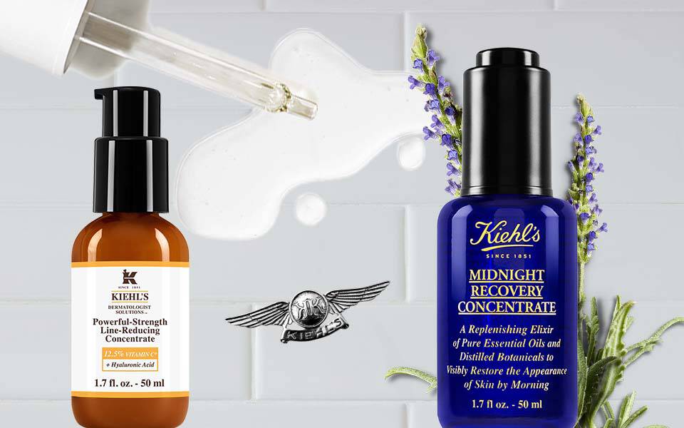 Zwei Flaschen Pflegeprodukte auf einem neutralen Hintergrund, links eine braune Flasche mit Pipette und rechts eine blaue Flasche.