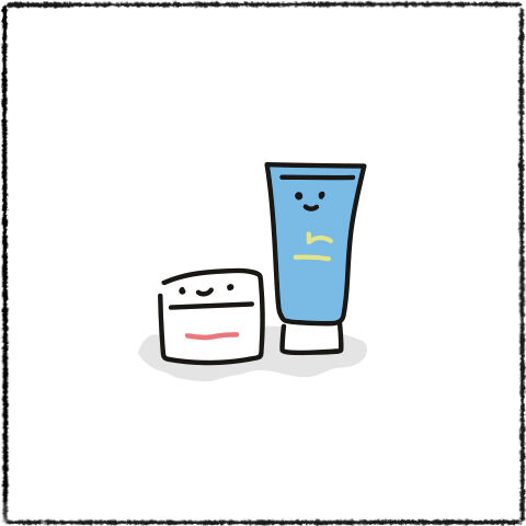 Two happy skin care products: a small round jar with a smiling face and a tall tube with a cheerful expression, both on a plain white background.